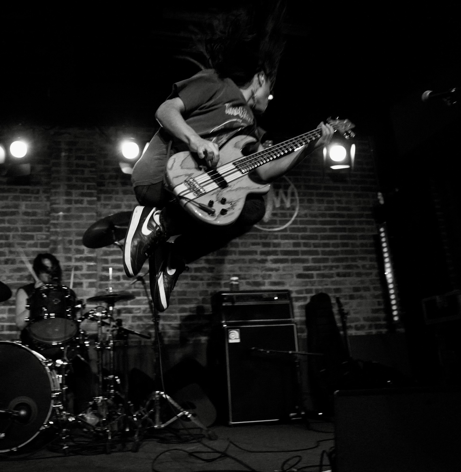Touring musician playing an Aria Pro II electric guitar